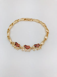 Pulsera Tres Elefantes Rojos Oro Laminado